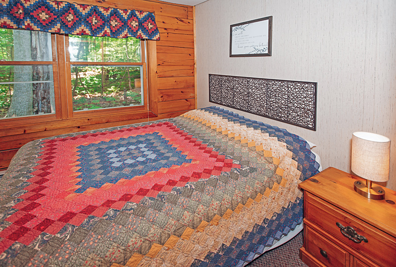 The Phenix Luxury Log Cabin Bedroom